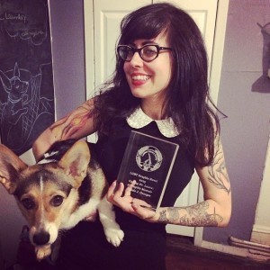 photo of Nicole J. Georges and corgi friend