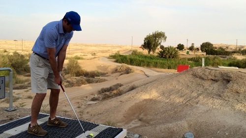 Author, caddy and recreational golfer Oliver Horovitz tees off at ‘Udhailiyah’s Wadi Al-Saeed Golf Club while visiting the area recently. The author of “An American Caddie in St. Andrews” said he would rather play the ‘Udhailiyah course than Pine Valley, the No. 1 ranked course in the world. Photo by Josh Olson