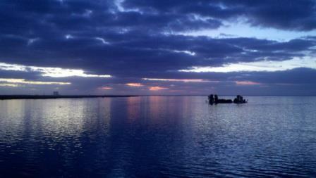 Before you get to the national seashore you have to cross the intercoastal waterways That separate the barrier islands from the mainland. . Early morning sunrise over the intercoastal waterway.