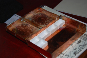 The box with the dimpled lid aside