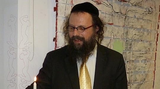 Ousted: Former Krakow Chief Rabbi Boaz Pash, shown lighting a Hanukkah candle in 2010, was known for his outreach and openness.