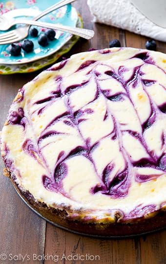 Ultra creamy Blueberry Swirl Cheesecake on a buttery, thick graham cracker crust. Guests will be begging for seconds! @sallybakeblog