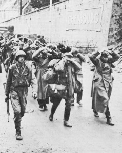 US infantry captain with German prisoner in Cherbourg, France, June 1944 (US Army Center of Military History)