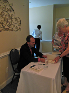 Signing books at the Moveable Feast