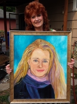 Sherry holding Julie portrait