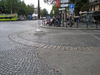 Paving stones mark the outline of the Bastille fortress, on the corner of the Place de la Bastille and the rue Sainte Antoine