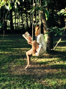 lazy summer days reading on swing