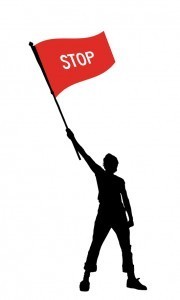 man holding a stop flag
