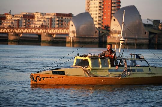 Adventurer Jason Lewis pedalling his boat Moksha on the River Thames