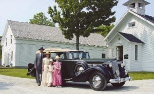 One of the autos, with some visitors ... but you don't have to come in costume!