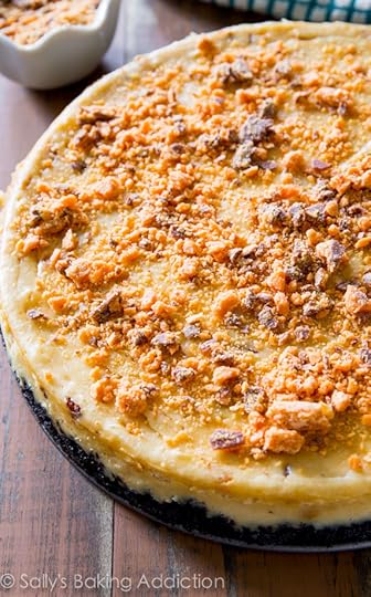 Everyone will go crazy for this Peanut Butter Butterfinger Cheesecake recipe! This is one incredible indulgent dessert. sallysbakingaddiction.com
