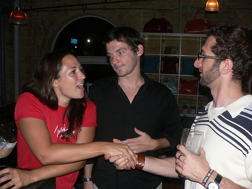 New friends shaking hands