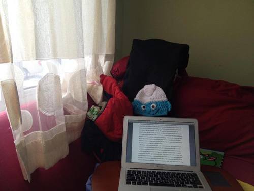 My not-so near writing space. And no, the smurf has no significance other than that's where the wee one's hat happened to be resting while I was writing. Sorta creepy.