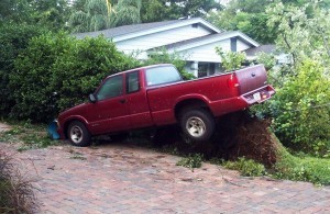 Large tree uprooted lifting truck - the aftermath of Hurricane Charley in 2004. Photo by Thomas Cook