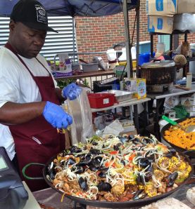 Adding the finishing touch to the paella.