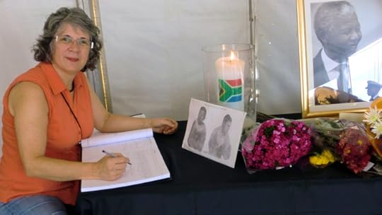 Signing the visitor book at Nelson Mandela's