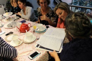 Guests at the High Tea examine my notebook 