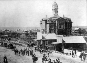 Parade passes the Tom Green County Courthouse on Sept. 17, 1888, celebrating the arrival of San Angelo's first train.