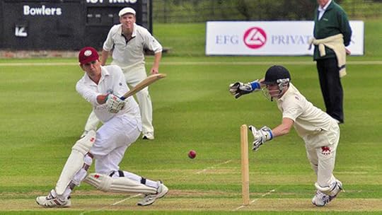 Damien Lewis looks on as Peter Frankopan strikes the ball