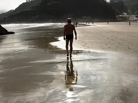 Man walking on beach alone