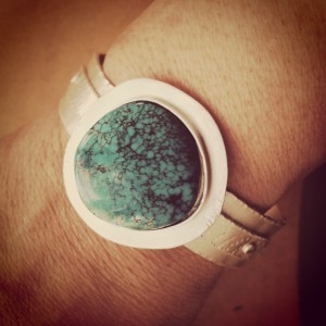 Turquoise cuff on arm