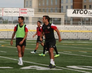 Shaun Saiko, in green, trains with the Scorpions, Saturday.