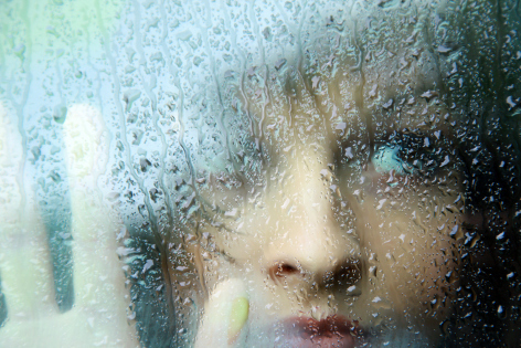 the_portrait_of_young_sad_woman_in_the_room__1341939366
