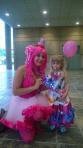 Brony Laura Wishart dressed as My Little Pony Character, Pinkie Pie, poses with a younger Pinkie Pie fan at BronyCon 2014.