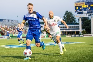 FC Edmonton's Albert Watson, foreground, keeps the ball from New York's Hans Denissen.
