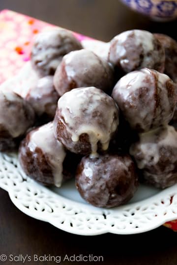 Moist chocolate donut holes, baked not fried, and thickly covered in a sweet glaze. Recipe @ sallysbakingaddiction.com