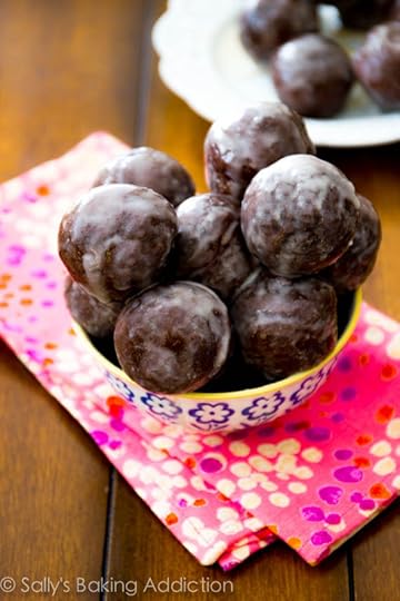 Moist chocolate donut holes, baked not fried, and thickly covered in a sweet glaze. Recipe @ sallysbakingaddiction.com