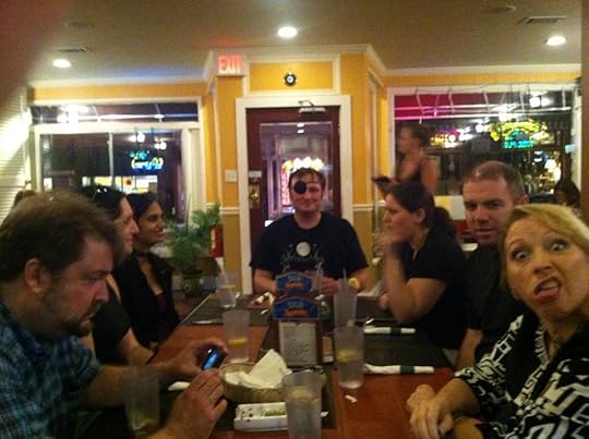 Dinner after the reading, taken with my iPhone. From left to right, John Langan, who is watching this video on Anita's phone; Nicole, Shveta, Laird, Jessica, my buddy Tim Dorsey from undergrad days at Virginia Tech(!); and Anita, expressing her opinion of my camera skills.