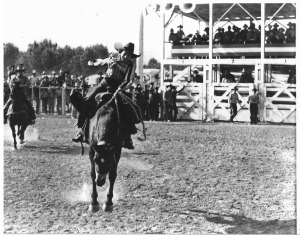Alice Greenough riding bronc