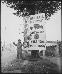 Corporal Charles H. Johnson of the 783rd Military Police Battalion, waves on a 