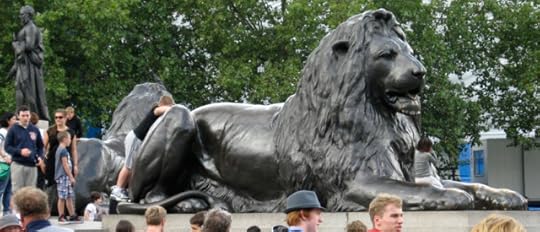 Another Trafalgar Lion, amid a sea of tourists. Amazingly, there is some greenery about him.