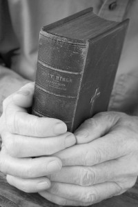Older Man Holding Bible