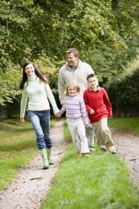 Family walking through countryside