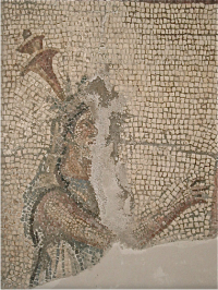 The thing that looks like it's on top of Her head is supposed to be an unlit torch that is sort of resting against Her shoulder and appears to be on Her head.
