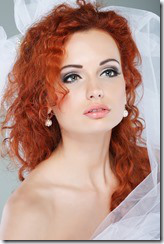 Portrait of beautiful redheaded bride. Wedding dress. Wedding decoration