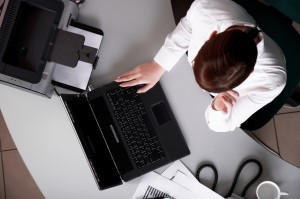 Young business woman working on a laptop
