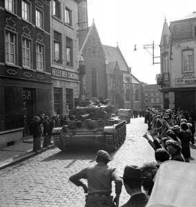 The crew of a British Cromwell Mk IV tank of 2nd Welsh Guards on the drive into Brussels, 3 September 1944. (Imperial War Museum)