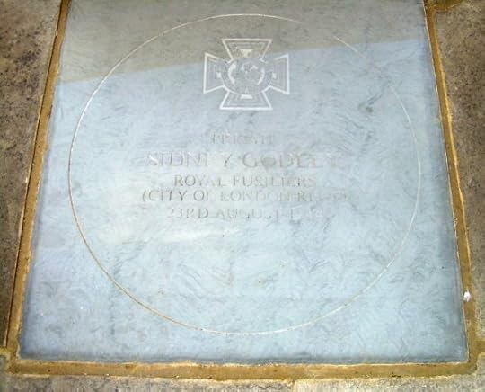The flagstone set into the foot of East Grinstead's war memorial honouring Godley's bravery and his commitment to his duty and to his comrades.