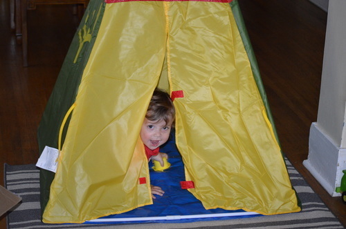 Ben peeping out  his birthday teepee from Great Grandmadele