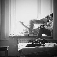 sexy couple kneel on books