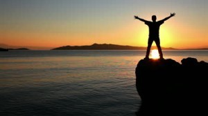 stock-footage-silhouette-of-a-man-practicing-yoga-at-the-sunset