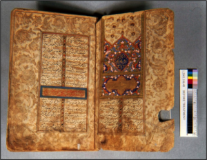Figure 1. Opening page showing tears and grime. The opening illumination on the right and the calligraphy are of poorer quality than the rest of the text. A chapter heading can be seen in the gold cartouche on the left.