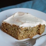 Spiced Zucchini Cake with Cream Cheese Frosting - Bake yourself happy with this spiced zucchini cake topped with a luscious cream cheese frosting.