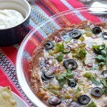 Six-Layer Nachos that You Can Make & Freeze - Viva la fiesta! These six-layer nachos are packed with flavor and are freezer-friendly. They go well poolside as well as at a tailgate party.