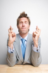 man-crossing-fingers-wishing