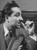 flicking-thumbnail-on-front-teeth-means-defiance